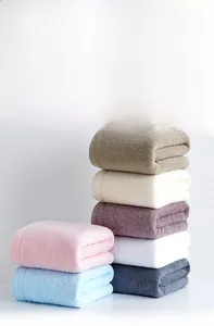 Macro detail of combed cotton towels showcasing soft texture and absorbent fiber structure