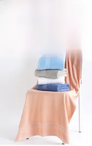 Close-up of premium combed cotton bath towels set with textured honeycomb borders