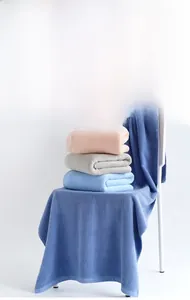 Close-up of soft combed long-staple cotton towels in pink, gray and blue colors