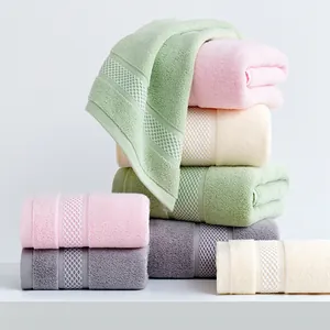 Thick pure cotton bath towels with honeycomb texture in four soft pastel colors