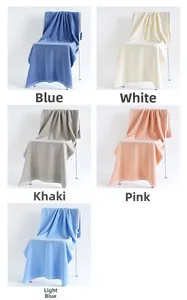 Detailed close-up showing soft cotton towel textures in blue, white, khaki, and pink colors