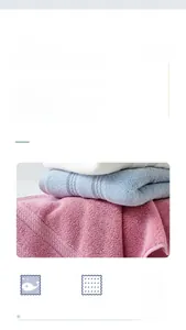 Macro detail of high-gram combed cotton towels with refined borders and dense loops