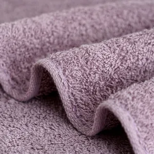 Thick purple cotton towel with high-density terry texture and reinforced edges