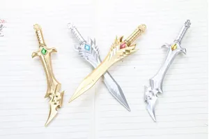 Detail of four miniature fantasy sword pendants with colorful faux gemstones and ornate hilts