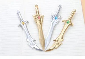 Macro detail of four fantasy sword-shaped pens with colorful gems on a notebook