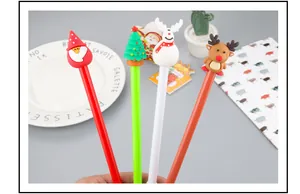 Close-up of Christmas gel pens featuring Santa Claus, reindeer, and pine tree toppers