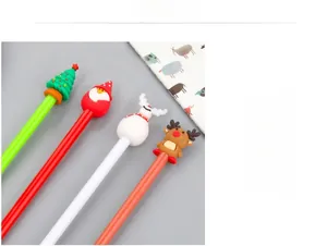 Close-up of four Christmas themed gel pens with silicone deer and snowman toppers