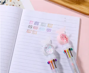 Detail of 10-color ballpoint pen with heart sequins showing multi-color ink ink swatches