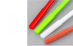 Detail of colorful plastic barrels in red, green, and orange for creative reindeer pens