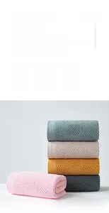 Detail of 100% cotton towels showing diamond textured weave and soft edges