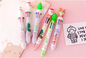 Close-up of 10-color Christmas ballpoint pens with cartoon Santa and reindeer toppers