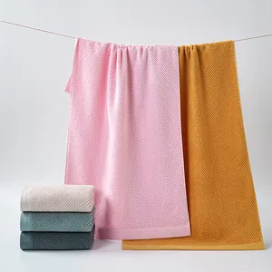 Plush 100% cotton towels in various Morandi colors with a 3D geometric diamond weave pattern