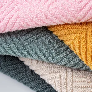 Stack of thick 50x100cm cotton towels in pink, blue, yellow, and grey colors
