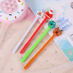Detail view of four Christmas themed gel pens with snowman and reindeer silicone toppers