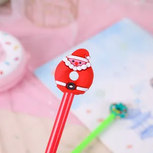 Close-up of a red Christmas gel pen featuring a cute silicone Santa Claus topper