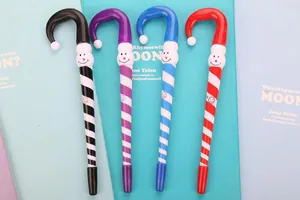 Detail of Christmas candy cane pens with cute snowman toppers in four assorted colors