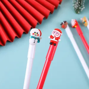 Détail de stylos gel de Noël avec des figurines en silicone de bonhomme de neige et renne