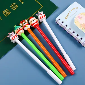 Détail de 5 stylos de Noël avec figurines d'animaux festives et encre noire liquide
