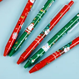 Détail de stylos de Noël rétractables avec motifs du Père Noël et pointe de 0,5 mm