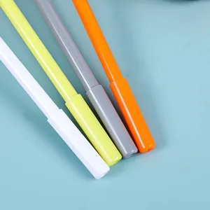 Detailed view of four colorful fine-liner pens in white, yellow, grey and orange