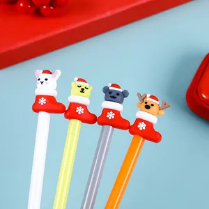 Detail of Christmas themed gel pens with cartoon characters in red holiday stockings