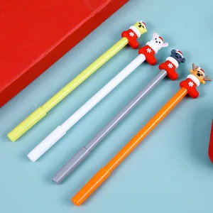 Close-up of colorful Christmas gel pens with reindeer, bear, rabbit, and cat toppers