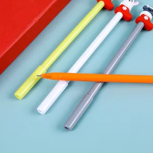 Christmas neutral pens with cartoon reindeer and pine tree toppers on blue background