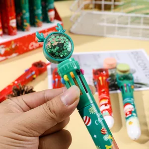 Close-up of Christmas 10-color ballpoint pen with cute reindeer antlers and green sequins