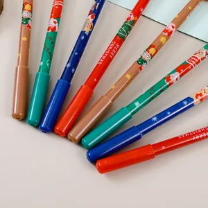 Detalle de bolígrafos de gel navideños multicolores con estampados festivos y dibujos de Navidad