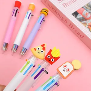 Close-up of creative multi-color pens with 3D cartoon food toppers on a pink background
