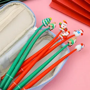 Detail of Christmas cartoon pens with silicone toppers and blue fabric pencil case