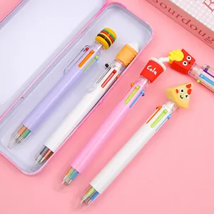 Detail of 10-color ballpoint pens with cute 3D fast food toppers on a pink desk