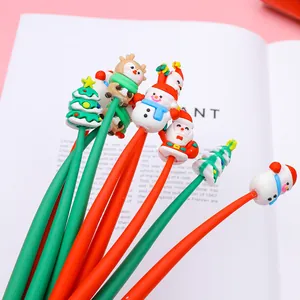 Close-up of Christmas gel pens featuring cartoon Santa, Snowman, and reindeer toppers