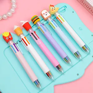 Close-up of multicolor pens with food-shaped charms like fries and burgers