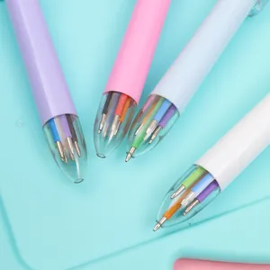 Macro shot of multi-color retractable ballpoint pens with a visible 6-in-1 ink refill tip