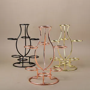 Three-tier wire frame metal display stand in black, rose gold, and gold for crystals