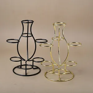 Close-up of golden and black metal multi-ball stands for crystal ball display