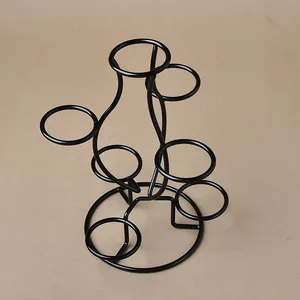 Detailed view of the multi-tier black metal stand showing seven display rings and circular base