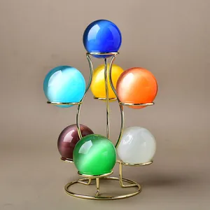 Modern gold metal seven-sphere stand with colorful cat eye glass balls for home decor