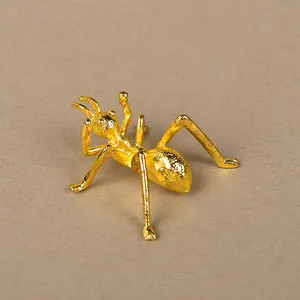 Creative golden alloy ant figurine used as a decorative crystal ball base stand