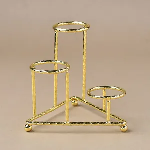 Three-tier gold metal crystal ball stand with spiral texture and tripod base for home decor