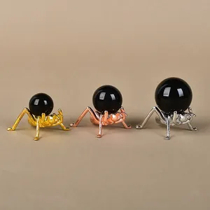 Three-piece metal ant ball stand set in gold, rose gold and silver finishes