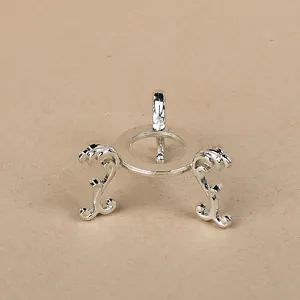 Silver metal tripod stand for crystal balls with elegant scroll patterns and polished finish