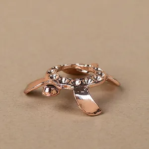 Detailed macro view of rose gold turtle metal base with crystal rhinestones on shell