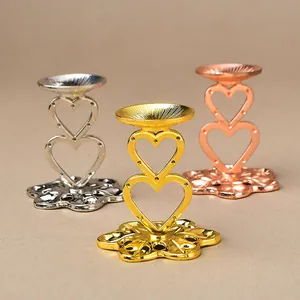 Set of heart-shaped metal crystal ball display stands in gold, silver, and rose gold