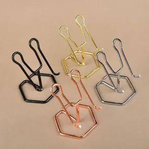 Four metal display stands in black, gold, silver, and rose gold with hexagonal base