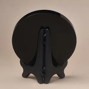 Polished black obsidian decorative disc with a sturdy folding display stand holder