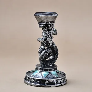 Antique silver snake crystal ball stand with resin texture and green triangle accents