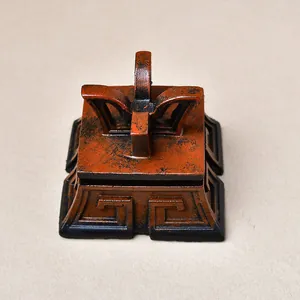 Vintage bronze resin square base with Greek key patterns and cross-shaped holder for crystal balls