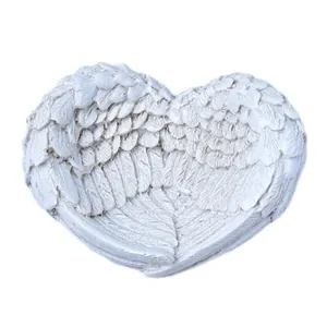 Plateau décoratif en résine blanche en forme d'ailes d'ange avec texture de plumes